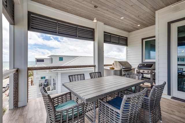 64 S Emerald Cove Ln, Inlet Beach, FL 32461 - sunroom featuring outdoor dining space and an outdoor kitchen