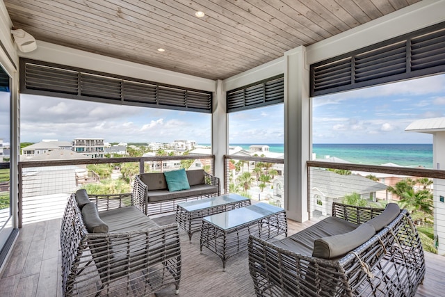 64 S Emerald Cove Ln, Inlet Beach, FL 32461 - sunroom featuring a water view and an outdoor hangout area