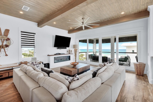 64 S Emerald Cove Ln, Inlet Beach, FL 32461 - living room featuring a glass covered fireplace, wood finished floors, a wooden ceiling with exposed beams, ceiling fan, and recessed lighting