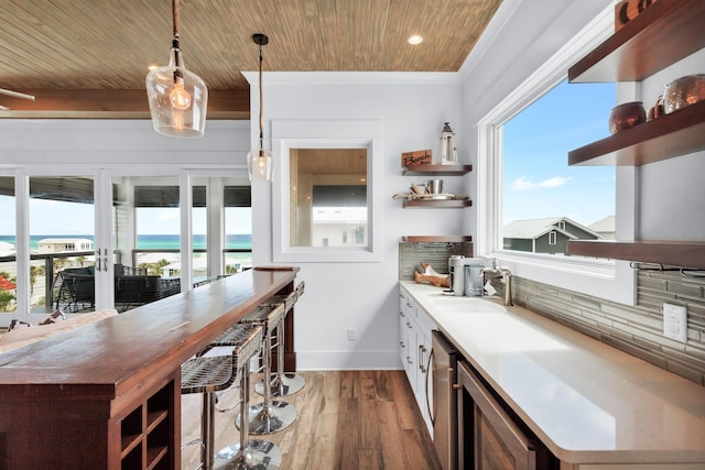 64 S Emerald Cove Ln, Inlet Beach, FL 32461 - kitchen with open shelves, beverage cooler, dark wood-style floors, healthy amount of natural light, and wood ceiling