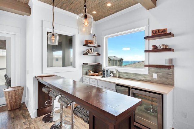 64 S Emerald Cove Ln, Inlet Beach, FL 32461 - kitchen featuring beverage cooler, open shelves, wood finished floors, recessed lighting, and decorative light fixtures
