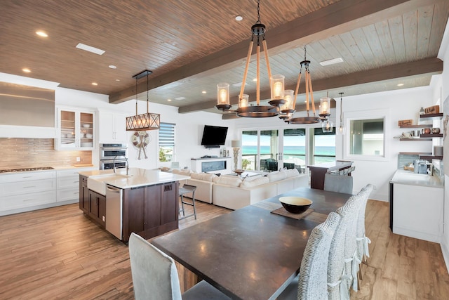 64 S Emerald Cove Ln, Inlet Beach, FL 32461 - dining space with a chandelier, light wood finished floors, a wooden ceiling with exposed beams, and recessed lighting