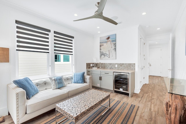 64 S Emerald Cove Ln, Inlet Beach, FL 32461 - living area with wine cooler, ornamental molding, bar area, light wood-type flooring, and ceiling fan