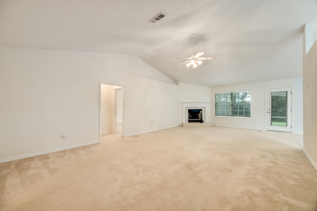 2124 Hagood Loop, Crestview, FL 32536 - unfurnished living room with ceiling fan, light colored carpet, a fireplace with raised hearth, and vaulted ceiling