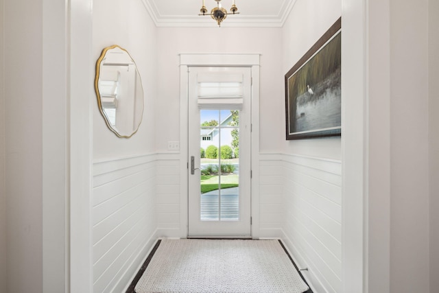 360 Jack Knife Dr, Inlet Beach, FL 32461 - doorway to outside with a wainscoted wall, ornamental molding, and a chandelier