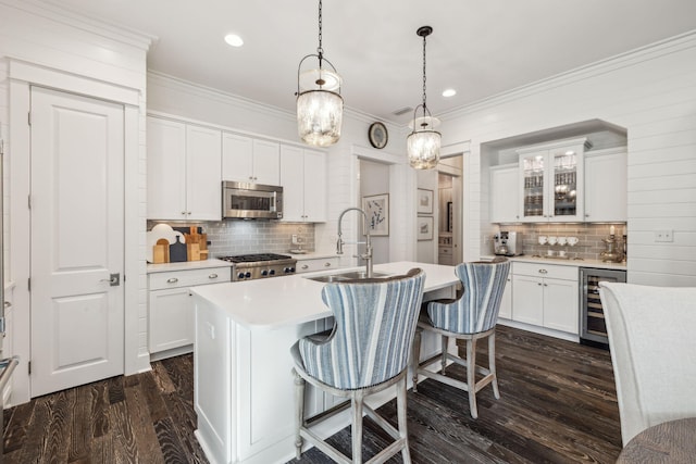 360 Jack Knife Dr, Inlet Beach, FL 32461 - kitchen featuring beverage cooler, appliances with stainless steel finishes, backsplash, dark wood-style floors, and ornamental molding