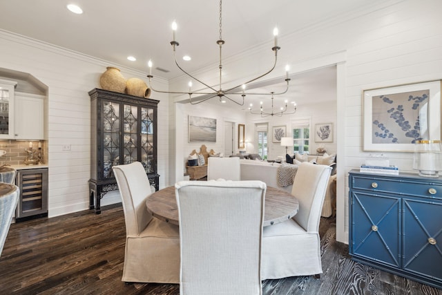 360 Jack Knife Dr, Inlet Beach, FL 32461 - dining area with beverage cooler, dark wood-style floors, ornamental molding, a chandelier, and recessed lighting