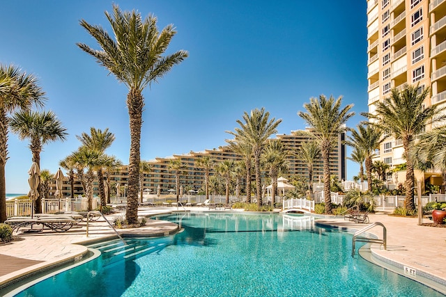 219 Scenic Gulf Dr Unit 930, Miramar Beach, FL 32550 - community pool featuring a patio area
