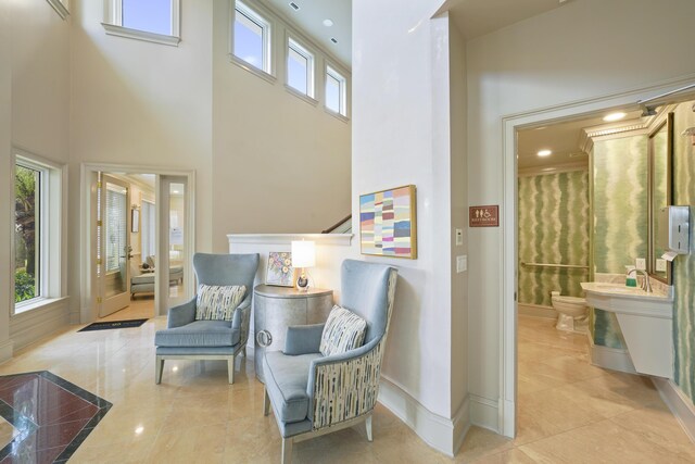 219 Scenic Gulf Dr Unit 930, Miramar Beach, FL 32550 - living area featuring a high ceiling and plenty of natural light