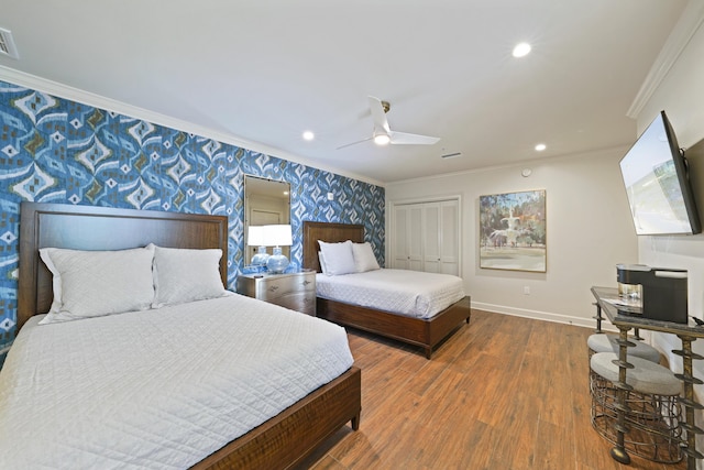 219 Scenic Gulf Dr Unit 930, Miramar Beach, FL 32550 - bedroom with wallpapered walls, crown molding, wood finished floors, a closet, and a ceiling fan
