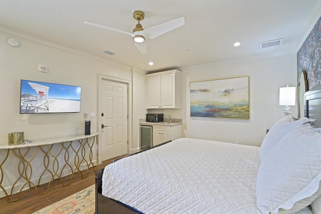 219 Scenic Gulf Dr Unit 930, Miramar Beach, FL 32550 - bedroom with wood finished floors, crown molding, ceiling fan, and recessed lighting