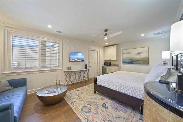 219 Scenic Gulf Dr Unit 930, Miramar Beach, FL 32550 - bedroom with ornamental molding, wood finished floors, recessed lighting, and a ceiling fan