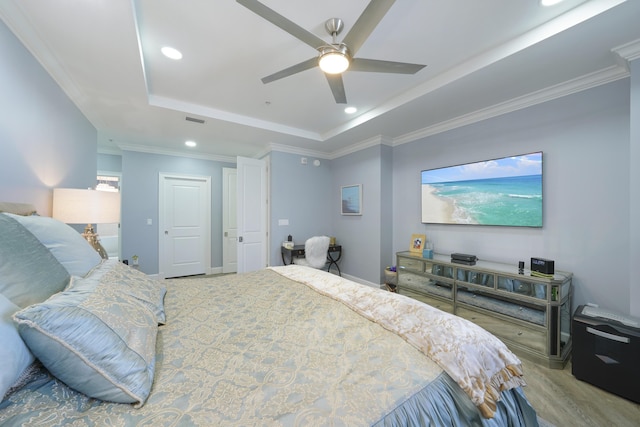 219 Scenic Gulf Dr Unit 930, Miramar Beach, FL 32550 - bedroom featuring a raised ceiling, recessed lighting, a ceiling fan, crown molding, and wood finished floors
