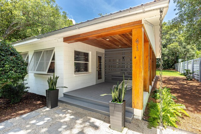 41 E Grove Ave, Santa Rosa Beach, FL 32459 - doorway to property with a deck and concrete block siding