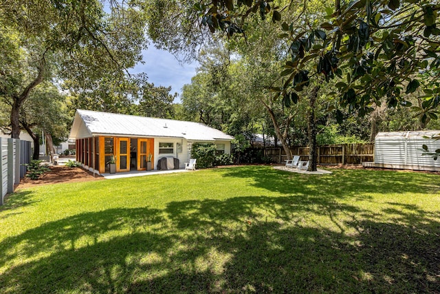 41 E Grove Ave, Santa Rosa Beach, FL 32459 - fenced backyard with an outbuilding