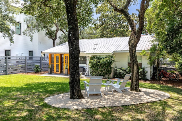 41 E Grove Ave, Santa Rosa Beach, FL 32459 - back of house with a patio and a metal roof