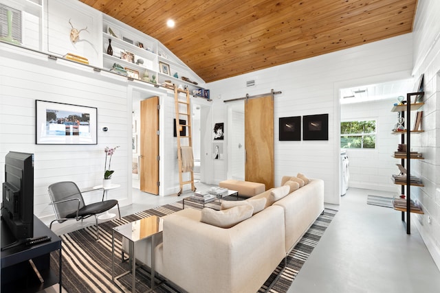 41 E Grove Ave, Santa Rosa Beach, FL 32459 - living area featuring a barn door, wooden ceiling, lofted ceiling, finished concrete flooring, and wooden walls