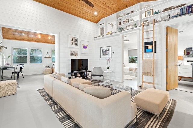 41 E Grove Ave, Santa Rosa Beach, FL 32459 - living room featuring wooden ceiling, wood walls, finished concrete floors, and a ceiling fan