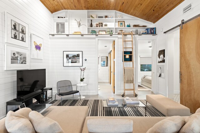 41 E Grove Ave, Santa Rosa Beach, FL 32459 - living room with a barn door, wood ceiling, vaulted ceiling, and wooden walls