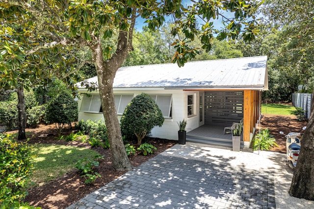 41 E Grove Ave, Santa Rosa Beach, FL 32459 - view of front facade featuring a metal roof and concrete block siding