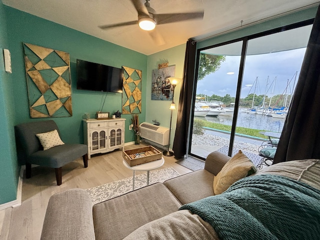 201 S Stillman St Unit 107, Pensacola, FL 32505 - living area with ceiling fan and wood finished floors
