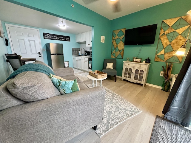 201 S Stillman St Unit 107, Pensacola, FL 32505 - living area with light wood-type flooring and baseboards