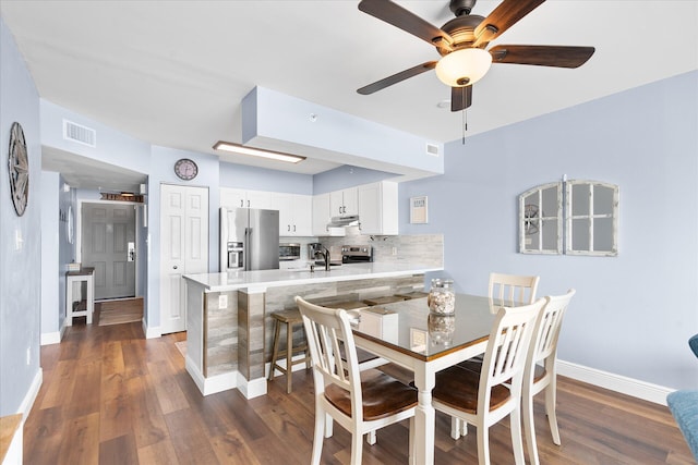 780 Sundial Ct Unit 2001, Fort Walton Beach, FL 32548 - dining space featuring a ceiling fan and dark wood-style floors
