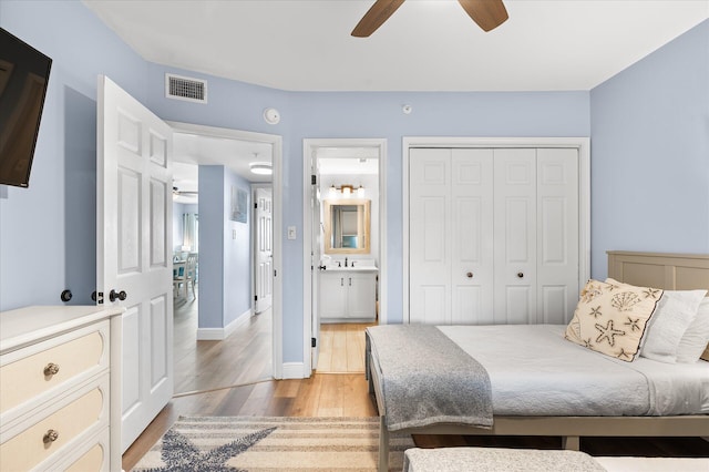 780 Sundial Ct Unit 2001, Fort Walton Beach, FL 32548 - bedroom with light wood finished floors, a closet, a ceiling fan, and ensuite bath
