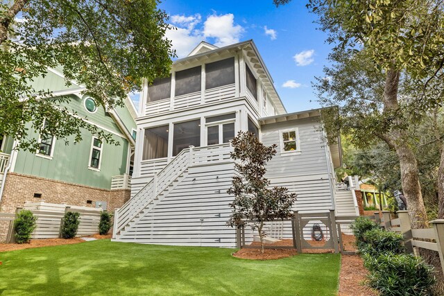 117 W Okeechobee, Santa Rosa Beach, FL 32459 - rear view of property with a sunroom, stairs, and a lawn