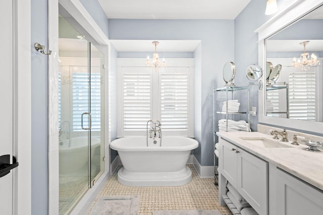 117 W Okeechobee, Santa Rosa Beach, FL 32459 - bathroom with a chandelier, vanity, a stall shower, and a soaking tub
