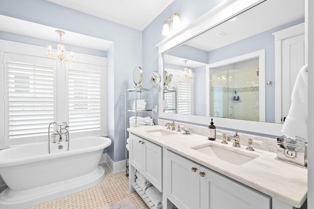 117 W Okeechobee, Santa Rosa Beach, FL 32459 - full bathroom with a chandelier, double vanity, healthy amount of natural light, and a soaking tub