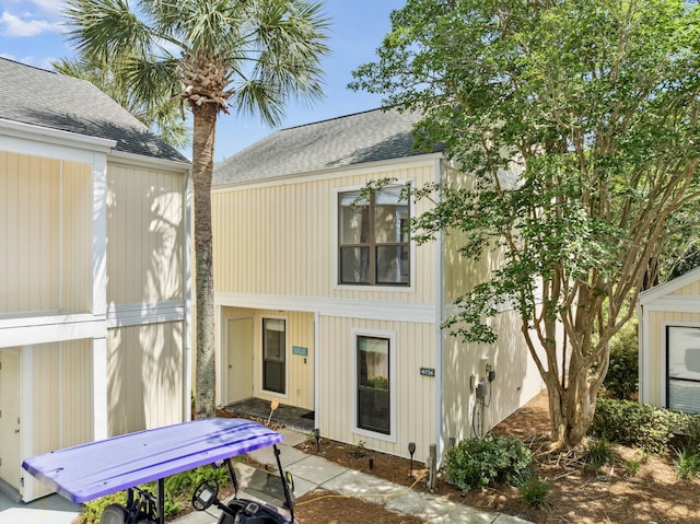 736 Sandpiper Pl Unit 10525, Miramar Beach, FL 32550 - rear view of house with roof with shingles and a patio area