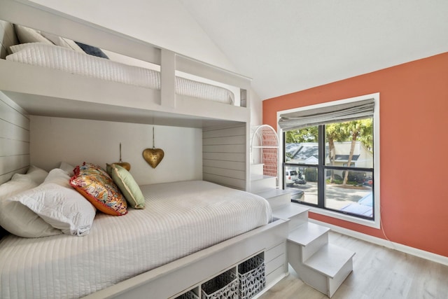 736 Sandpiper Pl Unit 10525, Miramar Beach, FL 32550 - bedroom with light wood-style floors and high vaulted ceiling