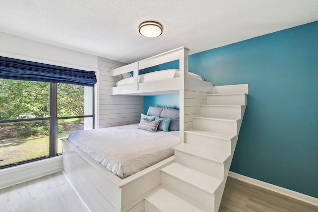 736 Sandpiper Pl Unit 10525, Miramar Beach, FL 32550 - bedroom featuring wood finished floors and a textured ceiling