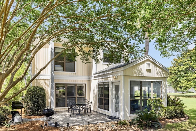 736 Sandpiper Pl Unit 10525, Miramar Beach, FL 32550 - rear view of property featuring a sunroom and a patio area