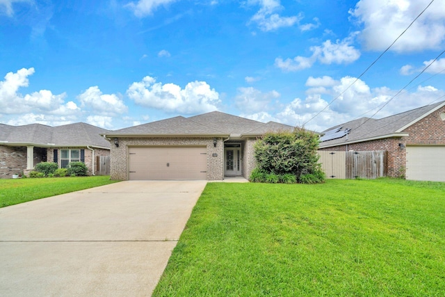 1369 N Beal Ext, Fort Walton Beach, FL 32547 - view of front facade with a garage, concrete driveway, brick siding, and roof with shingles