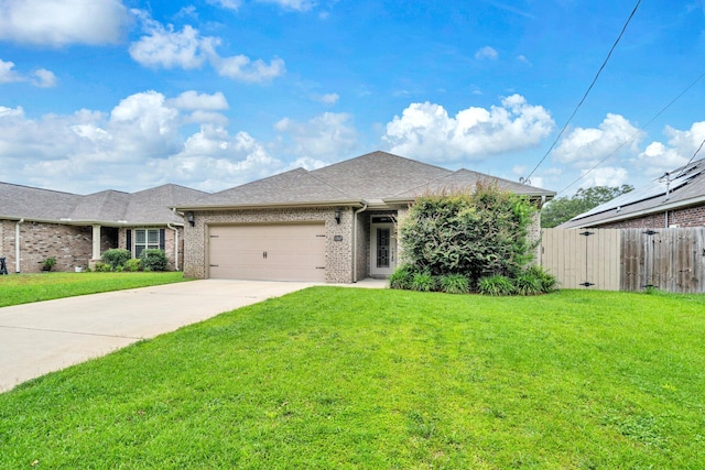 1369 N Beal Ext, Fort Walton Beach, FL 32547 - view of front of house with a garage, driveway, brick siding, and a shingled roof