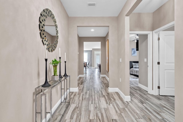 1369 N Beal Ext, Fort Walton Beach, FL 32547 - hallway featuring light wood finished floors and baseboards