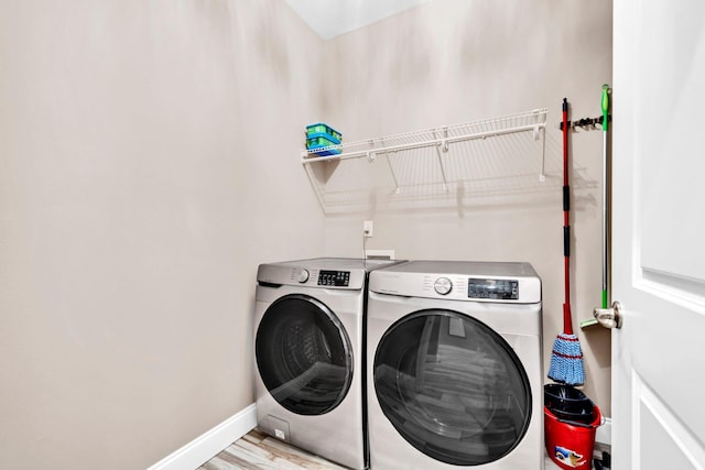 1369 N Beal Ext, Fort Walton Beach, FL 32547 - laundry area with washer and dryer and light wood-style flooring