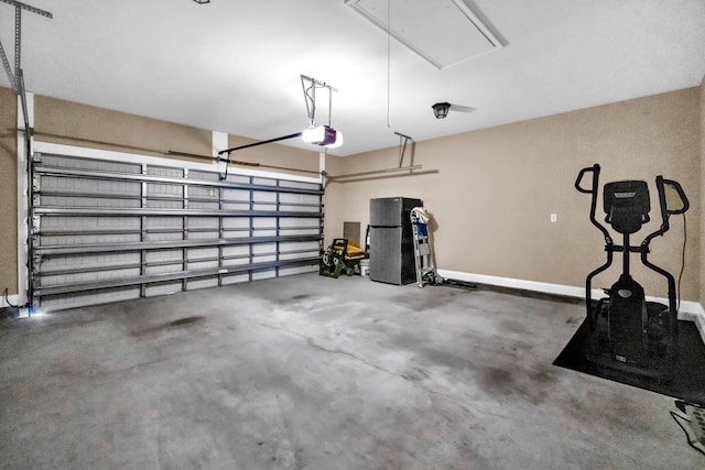 1369 N Beal Ext, Fort Walton Beach, FL 32547 - garage featuring a garage door opener and baseboards