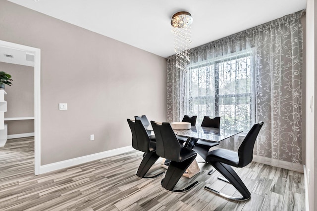 1369 N Beal Ext, Fort Walton Beach, FL 32547 - dining space with a chandelier and wood finished floors