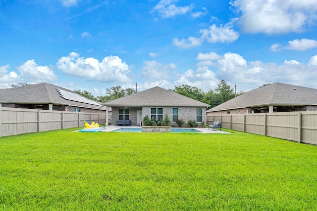 1369 N Beal Ext, Fort Walton Beach, FL 32547 - rear view of house with a patio area, a fenced backyard, and brick siding