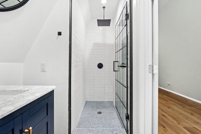 250 Bayou Cir, Freeport, FL 32439 - full bathroom featuring a shower stall, vanity, and wood finished floors