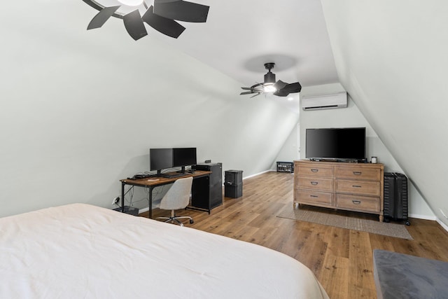 250 Bayou Cir, Freeport, FL 32439 - bedroom with vaulted ceiling, an AC wall unit, wood finished floors, and a ceiling fan