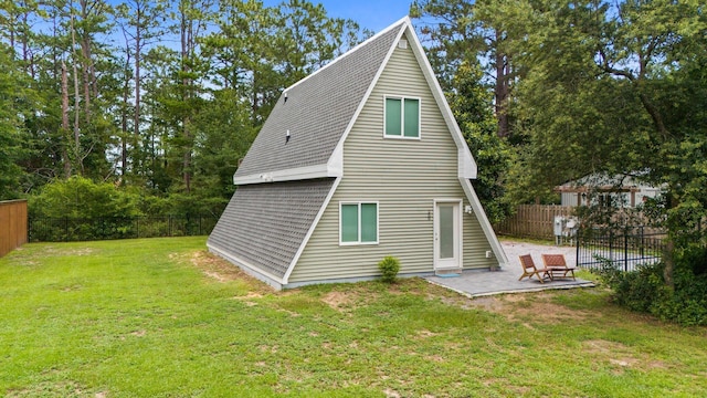 250 Bayou Cir, Freeport, FL 32439 - back of property featuring a patio area and a fenced backyard