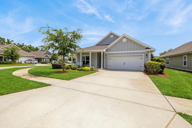 364 Lightning Bug Ln, Freeport, FL 32439 - single story home with board and batten siding, a front yard, concrete driveway, and an attached garage