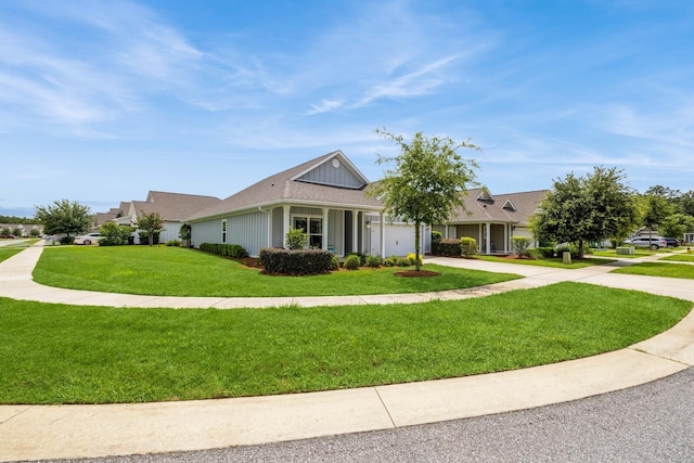 364 Lightning Bug Ln, Freeport, FL 32439 - ranch-style house featuring concrete driveway, an attached garage, and a front lawn