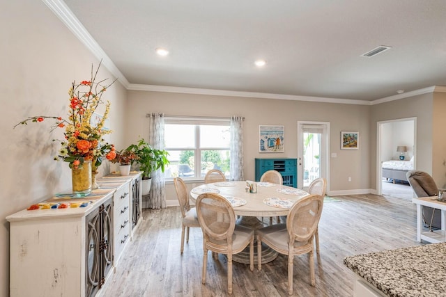 364 Lightning Bug Ln, Freeport, FL 32439 - dining area with crown molding, light wood finished floors, plenty of natural light, and recessed lighting
