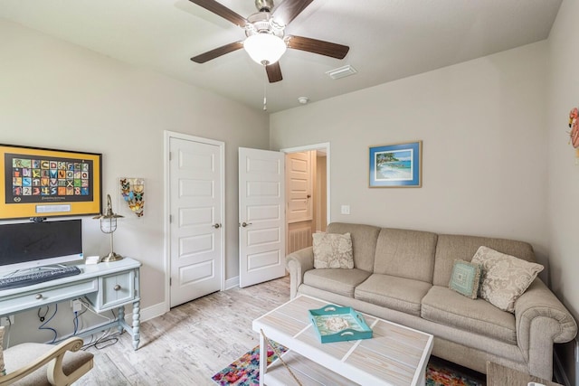 364 Lightning Bug Ln, Freeport, FL 32439 - living room with light wood finished floors and ceiling fan