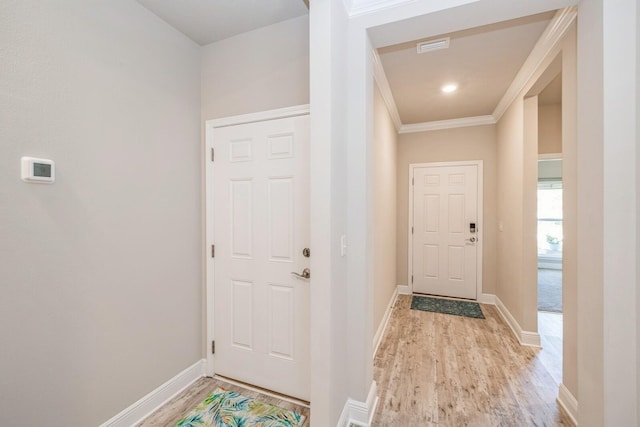 364 Lightning Bug Ln, Freeport, FL 32439 - doorway to outside featuring light wood-style flooring and ornamental molding